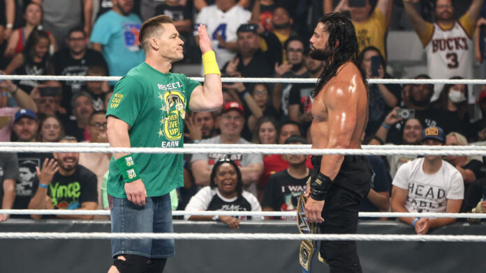 John Cena doing the 'You Can't See Me' taunt to Roman Reigns